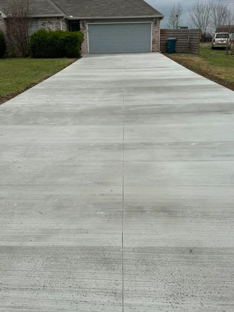 Fresh concrete driveway project by JA Excavation LLC